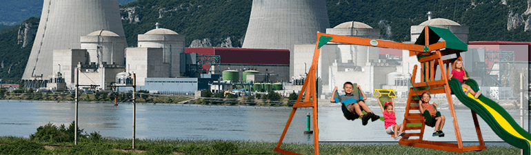 children playing in front of a nuclear power plant