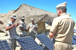 Marines with 7th Engineer Support Battalion, 1st Marine Logistics Group, explain the portable solar plant.