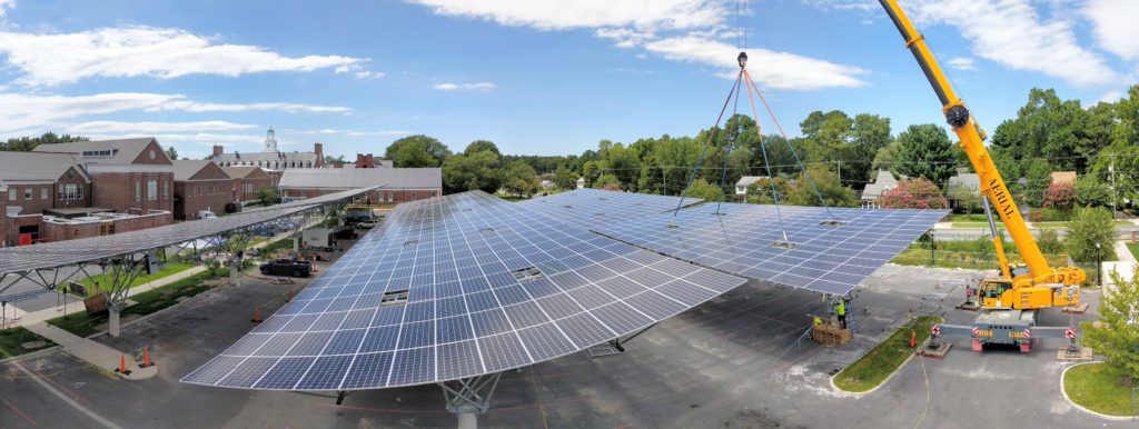 a large scale photo of a quest renewables installation - solar panels over a parking lot