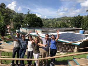 The RMI islands team in front of the Barranquitas solar microgrid