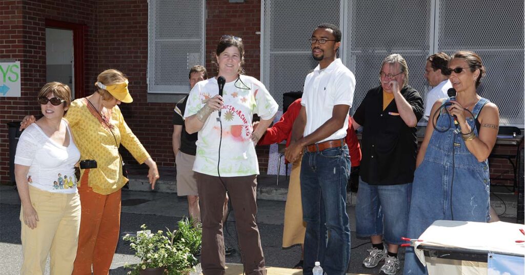 Anya Schoolman speaking at a local event about solar power